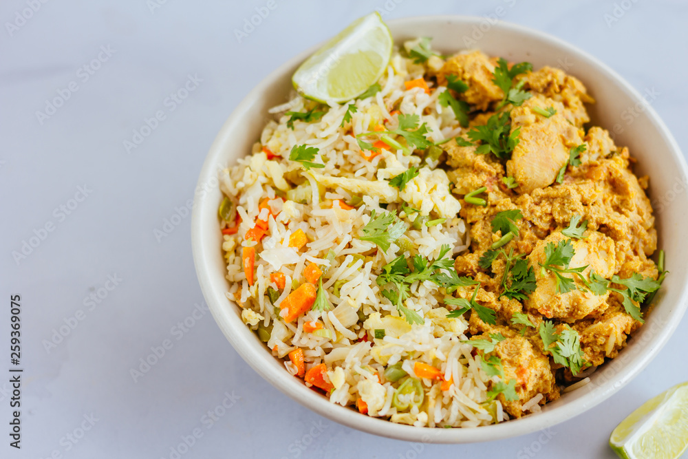 Fried Rice and Chicken Curry in a Bowl - Directly Above Photo. Indian Food, Indian Cuisine, Close Up Photo.