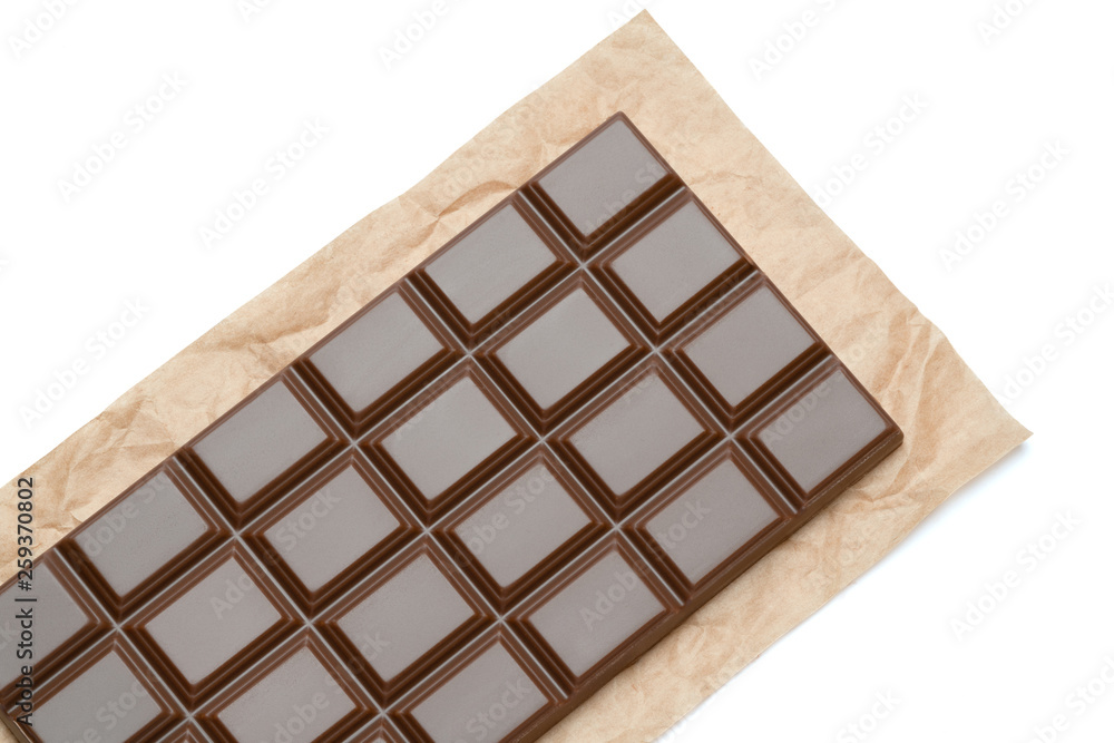 milk chocolate bar on craft packaging paper isolated on white background with clipping path milk chocolate bar on craft packaging paper isolated on white background with clipping path