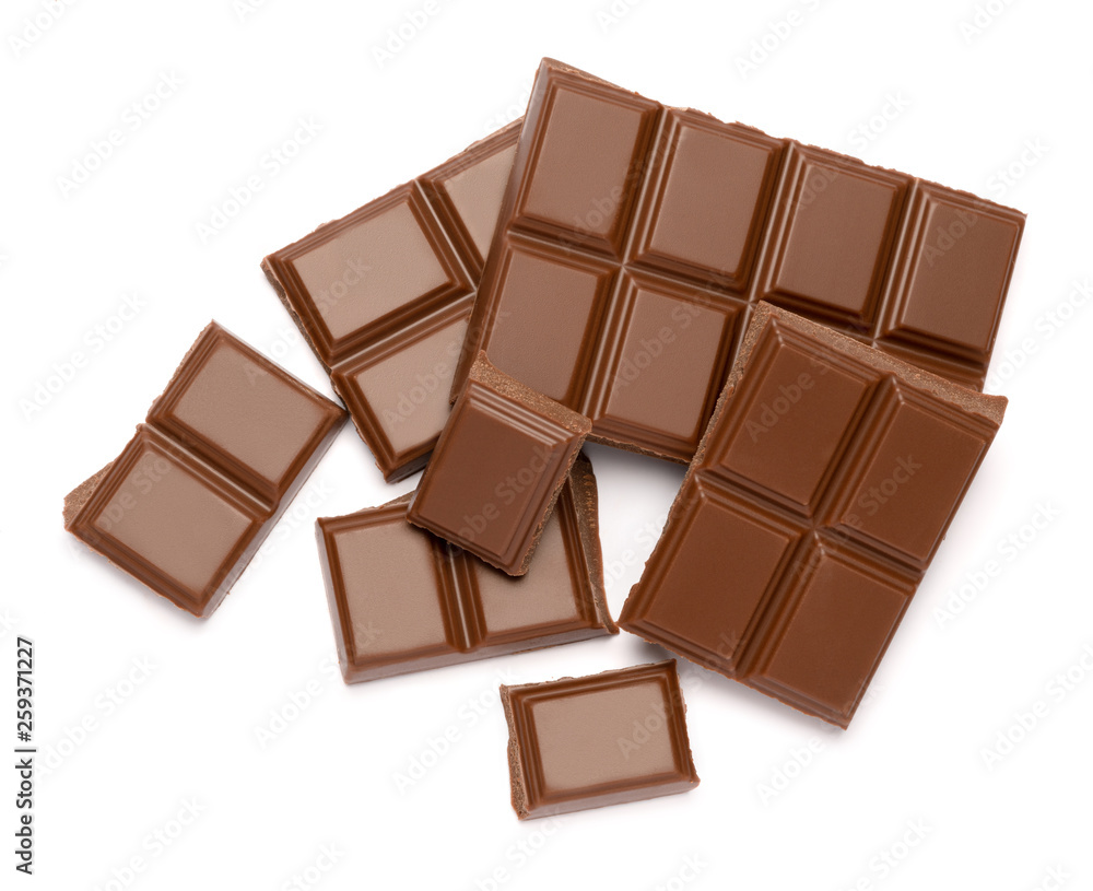 Milk organic chocolate pieces isolated on white background