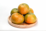 Orange in wooden plate. Orange honeydew Thai fruit white background
