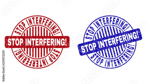 Grunge STOP INTERFERING Exclamation round stamp seals isolated on a white background. Round seals with distress texture in red and blue colors.