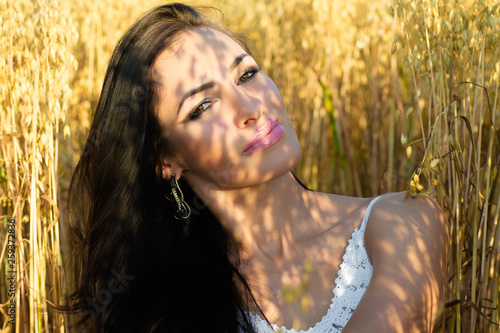 portrait charming brunette in the sunshine