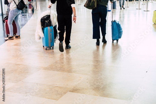 Valencia, Spain - March 8, 2019: Passengers with suitcases at an airport during vacations.