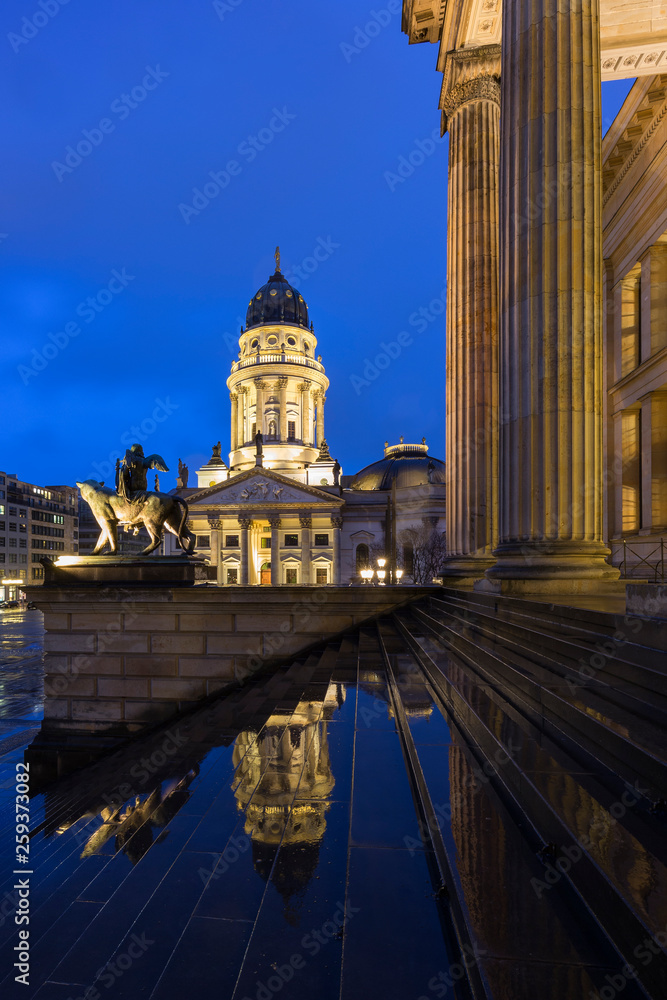 Illuminated Neue Kirche (Deutscher Dom, German Church or German Cathedral) and front of the Konzerthaus Berlin (Berlin Concert Hall) at the Gendarmenmarkt Square in Berlin, Germany, in the evening.