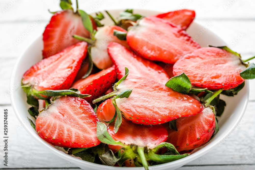 Juicy strawberry slices, fresh fruit in a bowl Juicy strawberry slices, fresh fruit in a bowl