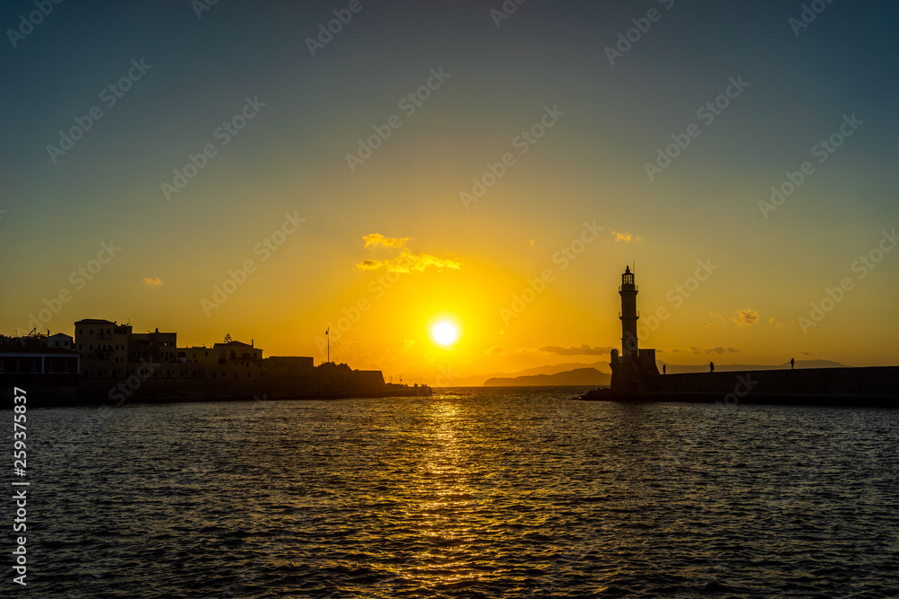 Panorama venetian harbour waterfront and Lighthouse in old harbour of Chania at sunset, Crete, Greece Panorama venetian harbour waterfront and Lighthouse in old harbour of Chania at sunset, Crete, Greece