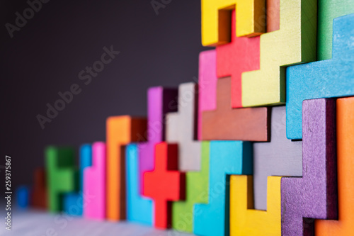 Geometric shapes on a wooden background.