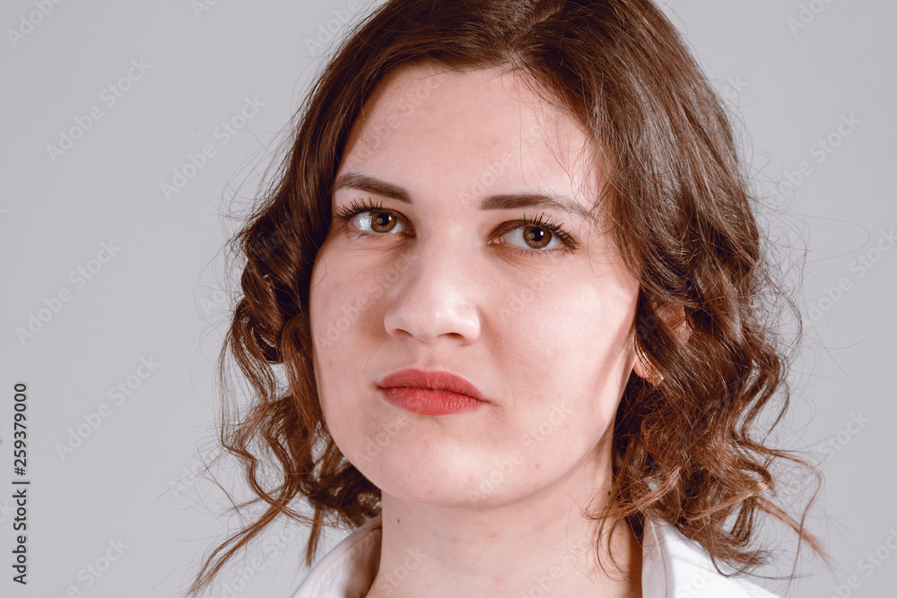 portrait of a girl in the studio on a light background portrait of a girl in the studio on a light background
