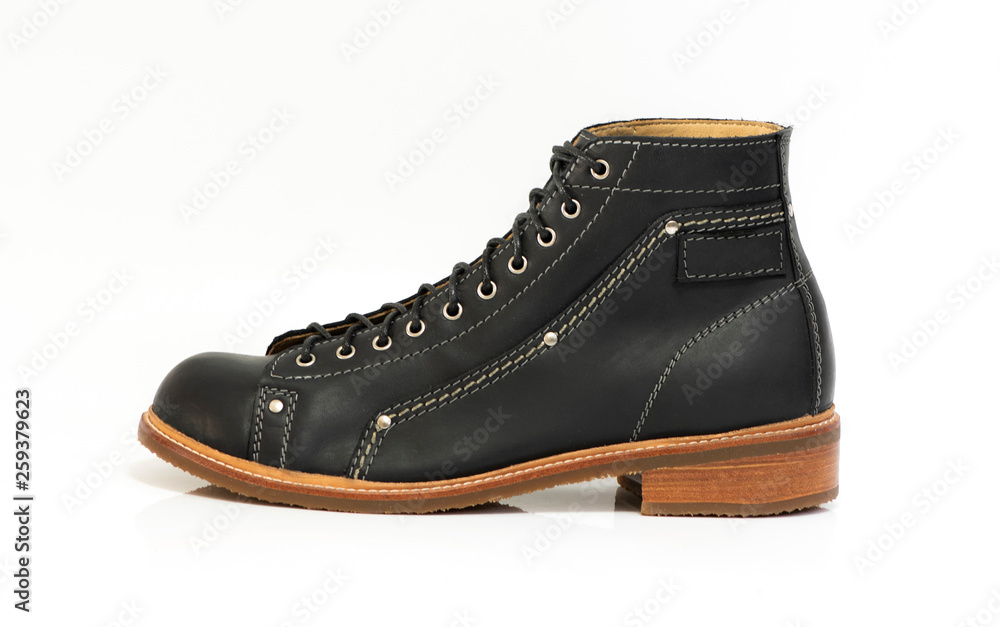 Black boot isolated on white background. Fashion advertising photos. Black boot isolated on white background. Fashion advertising photos.