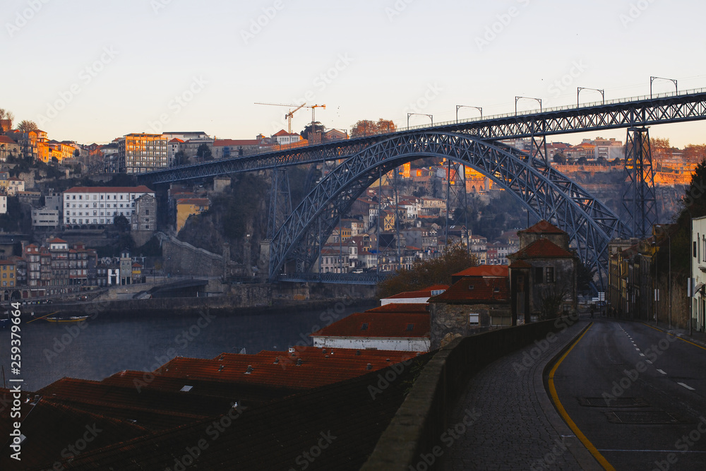 Dom Luis I bridge and Douro river during sunrise, Porto - Portugal.