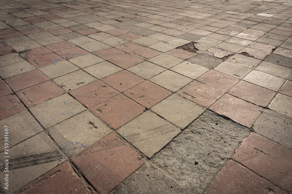 Fototapeta premium tattered time tiled beautiful floor in the town square in the southern edge