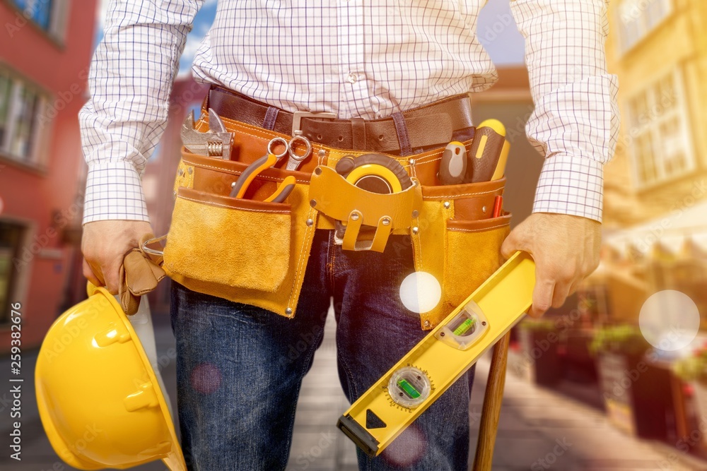 Worker with a tool belt. Isolated over background. Worker with a tool belt. Isolated over background.