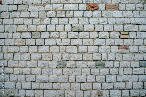 Wall of white bricks and other colors