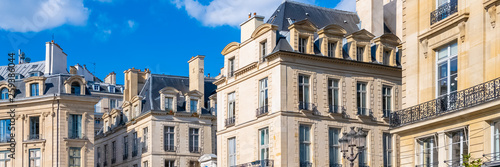Paris, beautiful buildings place des Victoires, typical parisian facades and windows