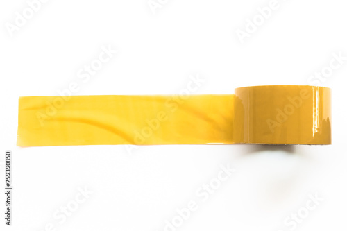 yellow tapes on white background. Torn horizontal and different size yellow sticky tape, adhesive pieces. photo