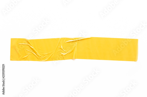 yellow tapes on white background. Torn horizontal and different size yellow sticky tape, adhesive pieces. photo