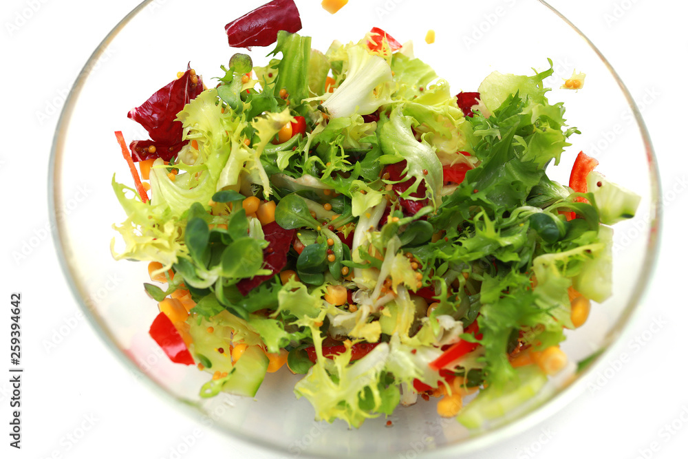 fresh salad in a glass bowl. Salad. Organic food. Healthy vegetable salad with escarole endive, frisee endive, chicory radicchio, lettuce in a glass bowl. Vegetarian food. fresh salad in a glass bowl. Salad. Organic food. Healthy vegetable salad with escarole endive, frisee endive, chicory radicchio, lettuce in a glass bowl. Vegetarian food.