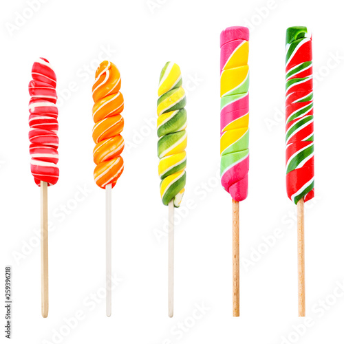 Set of colorful fruit flavored candies on white background