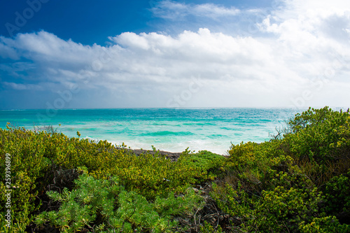 Beautiful landscape, coast of Caribbean Sea against blue Sky. Crystal Clear blue water in Tulum, Mexico 