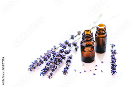 фотографія Dried lavender with a bottle of essential oil isolated on white background