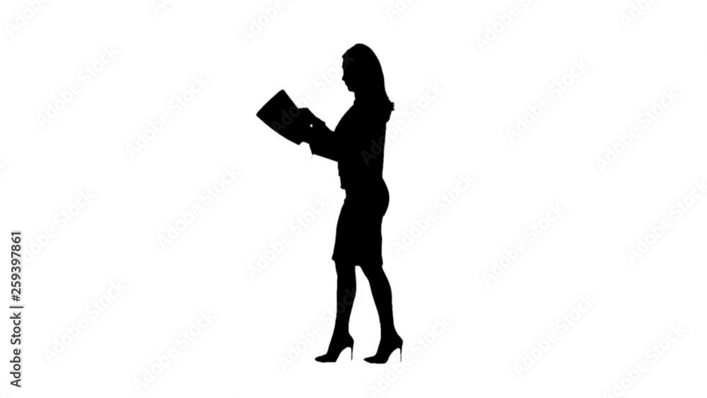 Girl with documents in their hands and walks . Side view. White background. Silhouette. Slow motion Girl with documents in their hands and walks . Side view. White background. Silhouette. Slow motion