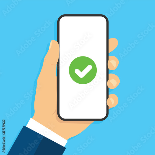 Hand holding smartphone with сheck mark. Success concept. Flat style - stock vector.