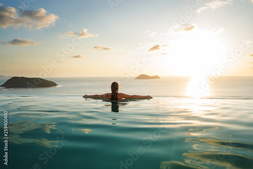 girl in the pool at sunset with views of the mountains and the sea © Rock and Wasp