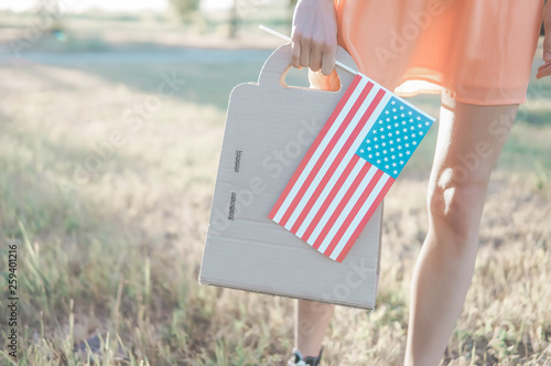 Woman shopping with recycled bag and american flag