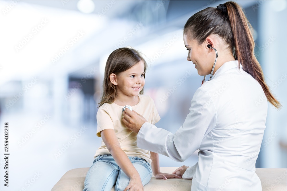 Young woman doctor with little girl in a hospital Young woman doctor with little girl in a hospital