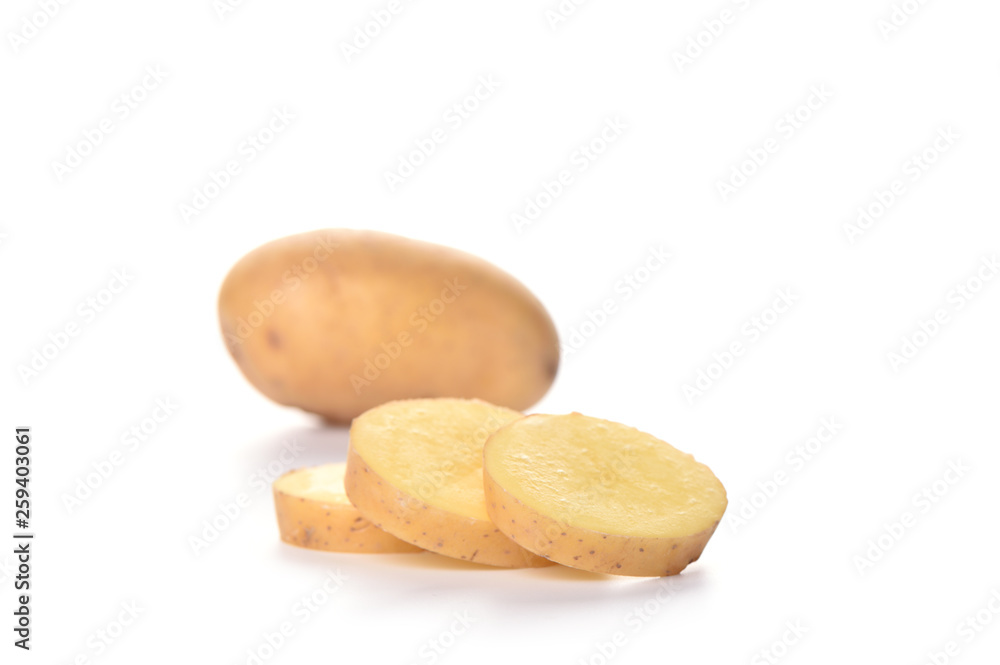 Selective focus. Potato cut slices isolated on white background. Copy space. Selective focus. Potato cut slices isolated on white background. Copy space.