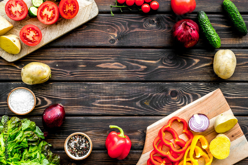 cooking with raw vegetables on dark wooden background top view mockup