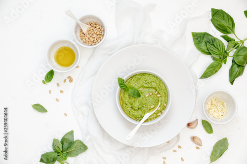 Pesto sauce with ingredients, overhead view