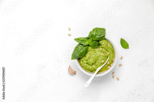Fotografiet Pesto in white bowl, view from above