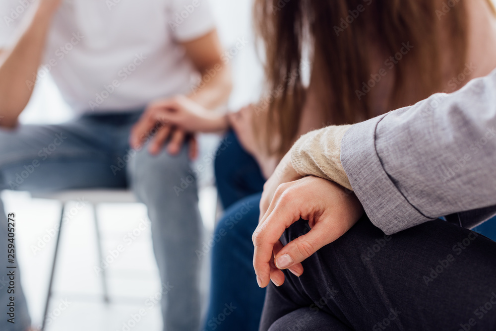 cropped view of hands of woman during group therapy session with copy space