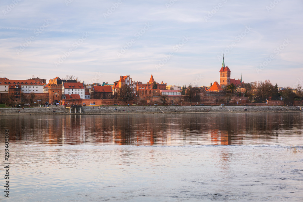 Torun old town reflected in Vistula river, Poland