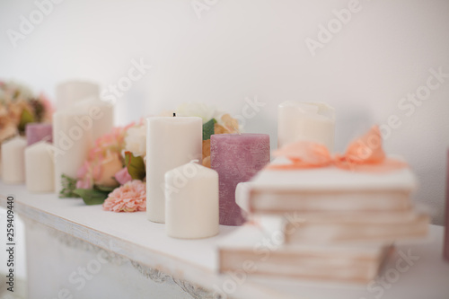 spa candles on white background with colorful flowers