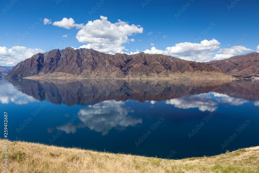 Scenic view of Lake Hawea and distant mountains