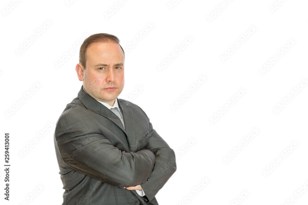 Stern businessman with crossed arms and copy space Stern businessman with crossed arms and copy space