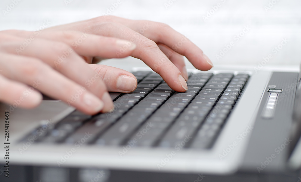 Female palms on laptop keyboard Female palms on laptop keyboard
