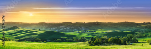 Idyllic view, green Tuscan hills in light of the setting sun