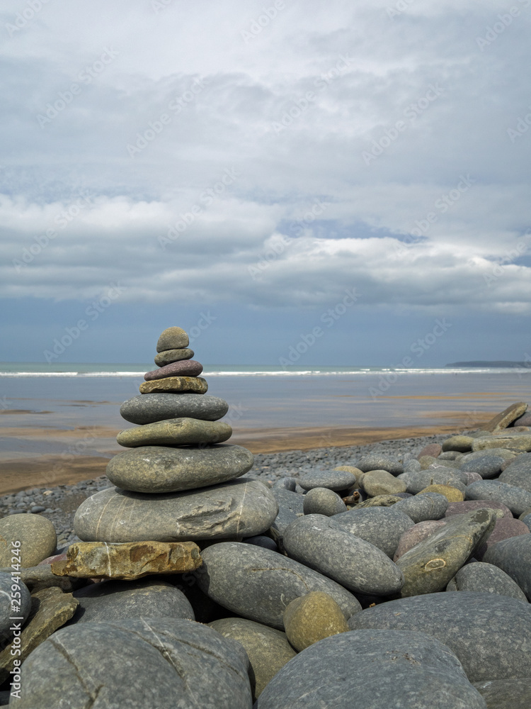 Fototapeta premium Holistic stone stack on the beach at Westward Ho! in Devon