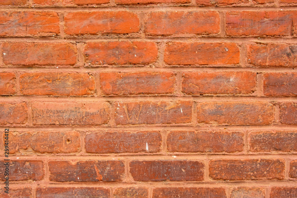Photo of old red brick wall with imperfections for background. Photo of old red brick wall with imperfections for background.