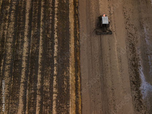 A Tractor ploughing the paddy field