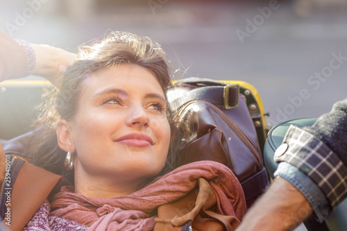 Smiling woman relaxing in car