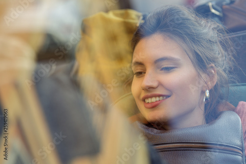 Smiling woman sitting in car