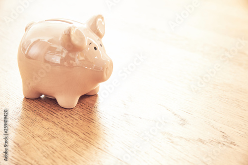 Piggy bank on an wooden floor