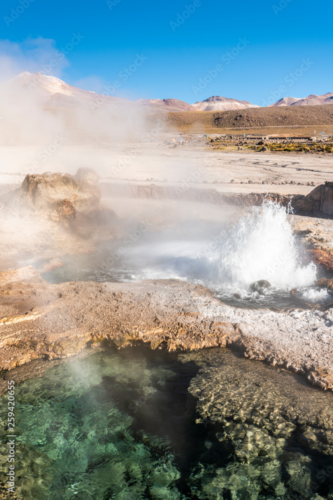 El Tatio Geysers at Atacama desert, amazing thermal spring waters at 4500 masl inside Andes mountains a place with an awe geothermal activity below the ground. Volcanic activity at Atacama scenery
