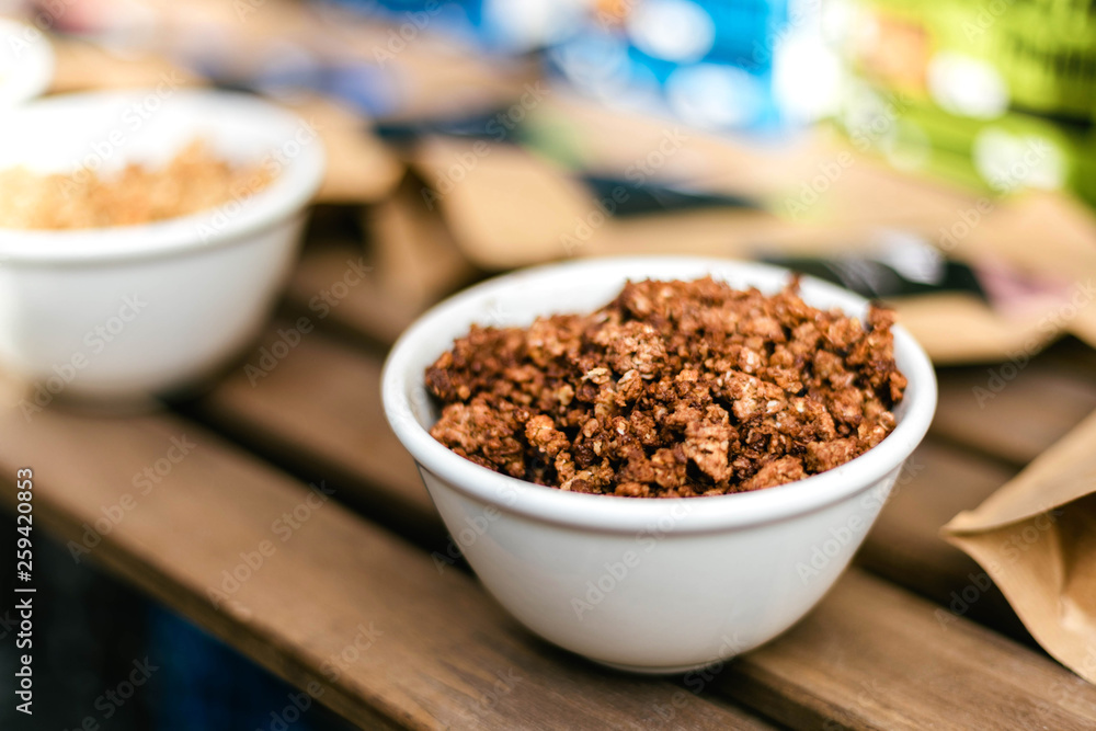 Homemade granola with nuts and seeds in thaplate for healthy breakfast Homemade granola with nuts and seeds in thaplate for healthy breakfast