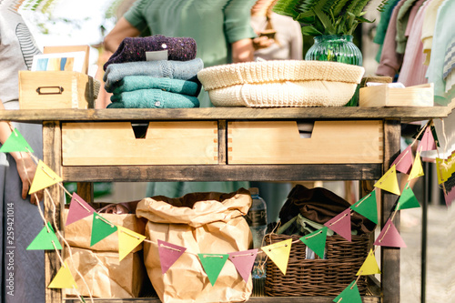 Schilderij op canvas Colorful flags, craft paper bags and goods for garage sale on the summer vintage