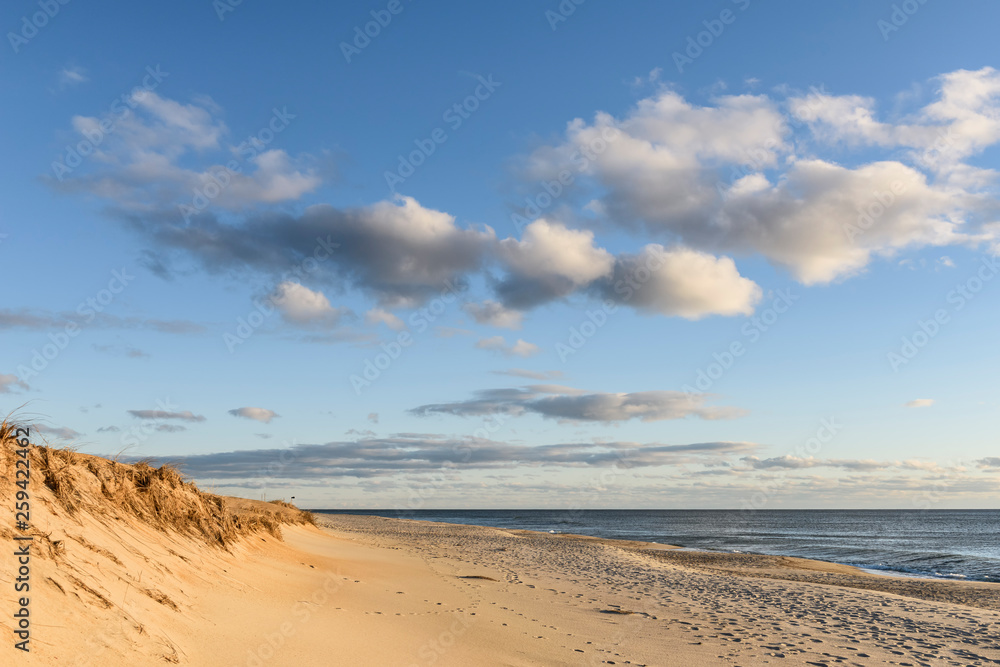 Sand Dunes and Beautiful Sky on Beach at Sunrise